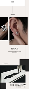 Close-up of vintage silver star magnetic earrings showing aged metal texture and detail