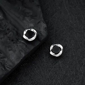 Silver Mobius magnetic earrings with black round center and spiral texture finish