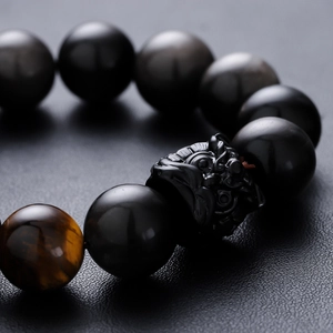 Tiger eye and black bead bracelet with a detailed hand-carved Pixiu charm for men