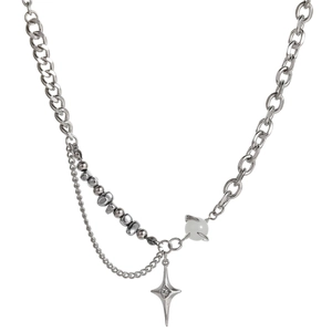 Detail of silver titanium steel necklace with cat eye bead and star pendant