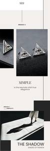 Macro shot of triangle eye stud earrings with red gemstone and vintage silver finish
