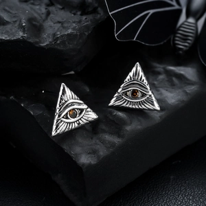Silver Eye of Horus triangle stud earrings with amber stone and gothic design