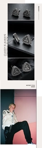 Detailed macro view of vintage triangle stud earrings with black stones and punk texture