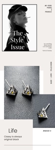 Vue rapprochée de boucles d'oreilles triangulaires avec un totem œil mystique
