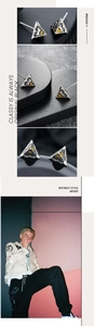 Détails macro de boucles d'oreilles triangle avec motif œil et finition argent vintage