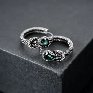 Retro silver snake style hoop earrings with dark green stones and twisted knot patterns