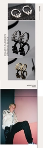 Detailed view of micro-pave zircon hoop earrings in silver, black, and gold finishes