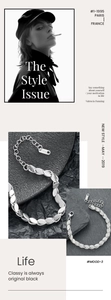 Macro detail of silver stainless steel leaf chain bracelet with lobster clasp and extender