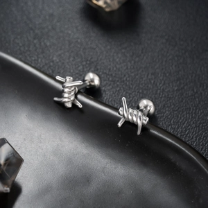 Polished silver barbed wire stud earrings with edgy industrial design for men and women