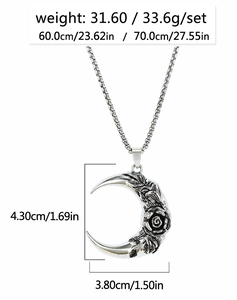 Detail of crescent moon pendant with embossed rose and leaves on a box chain