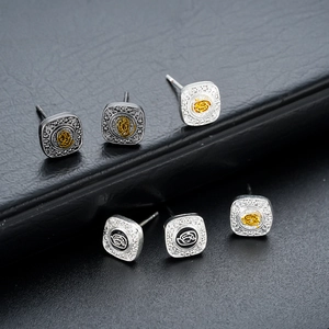 Square stud earrings set with vintage metal finish and embossed logo design