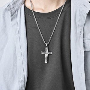 Men's vintage pebble texture stainless steel cross necklace worn with casual outfit