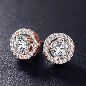 Elegant rose gold halo stud earrings featuring round cubic zirconia and pavé accents