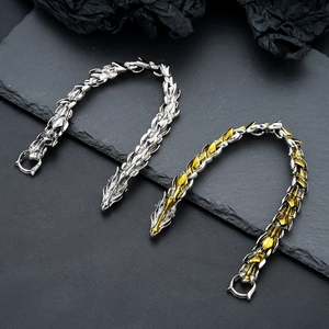 Vintage dragon scale chain bracelet with intricate dragon head clasp in silver and gold tones