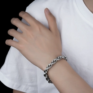 Minimalist textured titanium steel chain bracelet shown on model wrist for a casual look