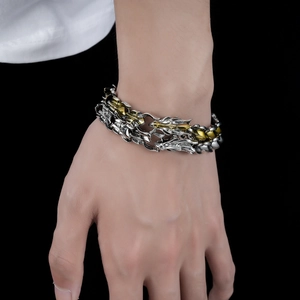 Retro dragon head bracelet in gold and silver tones with link scale texture