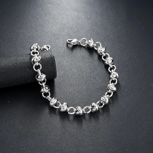 Titanium steel knot chain bracelet with pearls and lobster clasp on black display