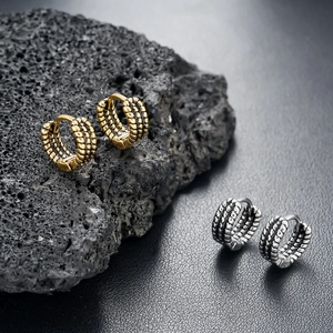 Vintage braided texture hoop earrings for men in gold and silver finish on volcanic stone