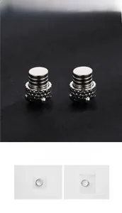 Macro detail of industrial dragon claw magnetic earrings with blue grid metal texture