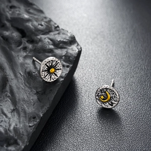 Retro oxidized silver sun and moon stud earrings with vintage hammered texture