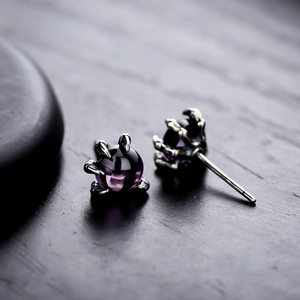 Gothic dragon claw stud earrings with purple amethyst stones and silver setting
