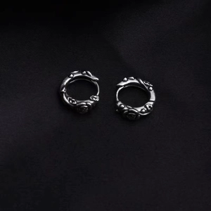 Vintage oxidized silver rose earrings with gothic floral engravings on black silk