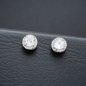 Macro shot of silver magnetic halo ear cuffs featuring large round cubic zirconia stones