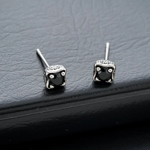 Vintage dragon claw stud earrings with square black zircon on textured leather