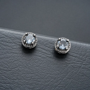 Magnetic zircon ear clips with light blue crystals and black micro-gem stone halo