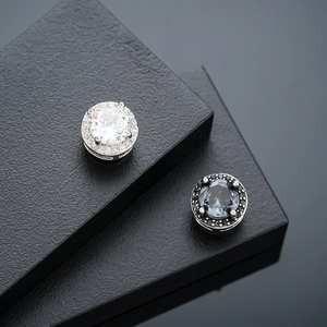 Magnetic zircon ear clips in silver with white stones and black with deep blue crystals