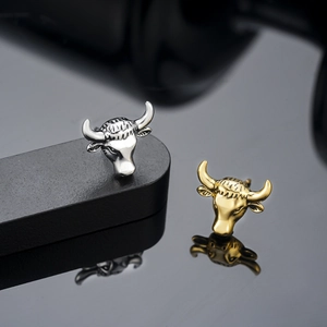 Vintage bull head stud earrings in gold and silver finish with detailed 3D carving