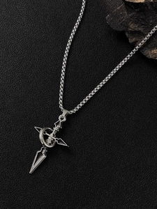 Detail of silver cross dagger pendant on box chain over black leather background