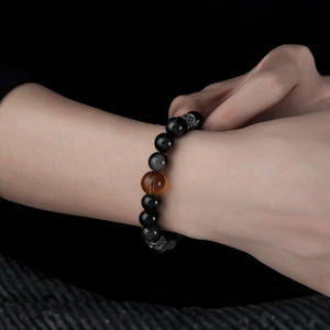 Natural silver obsidian beaded bracelet with cat eye effect and amber accent bead