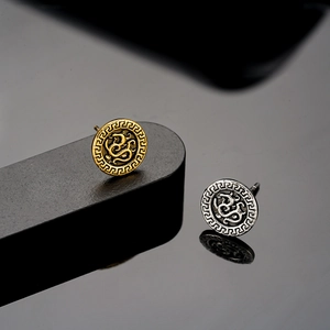 Vintage dragon totem studs in gold and silver finish with Greek key border pattern