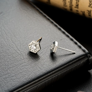 Hexagonal sunburst stud earrings with CZ stones and SINCE engraving in silver