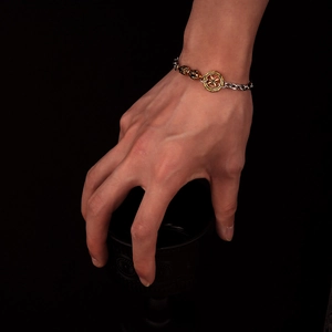 Vintage Armband im tibetischen Stil mit Sonnenrad-Anhänger in Gold und Silber-Optik