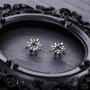 Gothic punk star stud earrings in dark silver metal with 3D octagonal star design