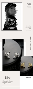 Macro detail of punk style angel wing and sword studs in gold and silver finishes