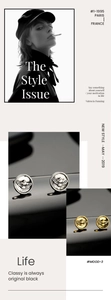 Macro view of eagle crest studs in gold and silver finish with vintage relief detail