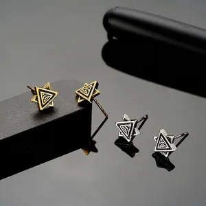 Gothic Eye of Providence hexagon studs in polished gold and silver finish