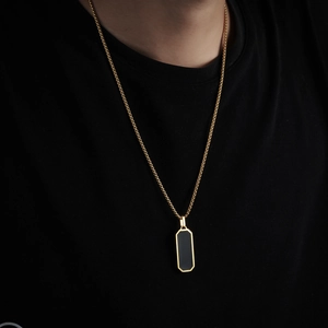 Titanium steel gold necklace with black square pendant on male model wearing black t-shirt
