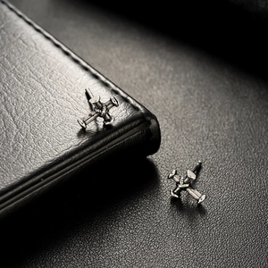 Vintage industrial style cross nail stud earrings in silver-black metallic finish