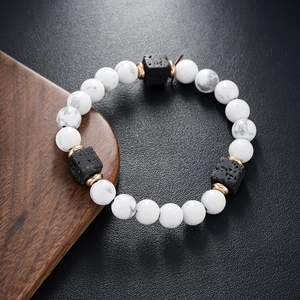 Men's matte volcanic stone and white marble beaded bracelet with gold metal accents