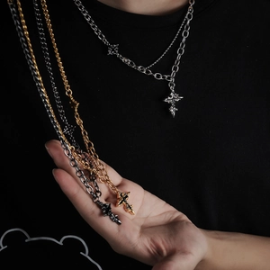 Titanium steel cross necklace set featuring layered Cuban chains in silver and gold