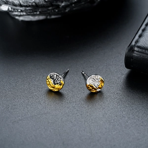 Minimalist bicolour silver and gold studs with irregular crinkle texture for men and women