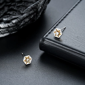 Hexagonal sunburst stud earrings with silver metal and round center zircon stone