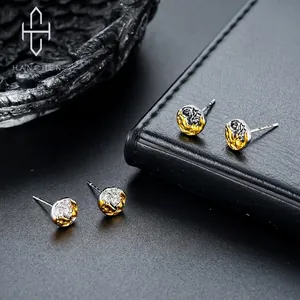 Lava texture gold and silver earrings with irregular minimalist mountain design