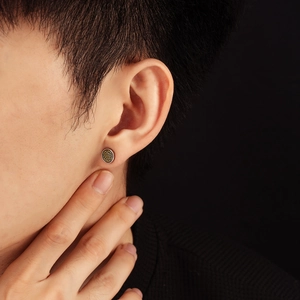 Vintage round studs for men featuring a silver frame and golden mandala pattern
