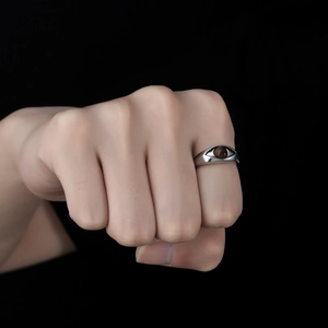 Detailed close-up of retro silver ring featuring a brown tiger eye stone in eye-shaped design