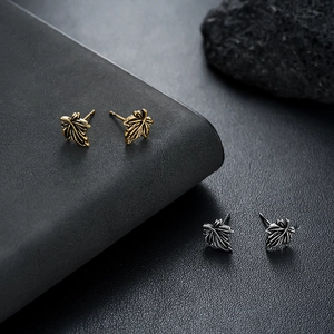 Vintage maple leaf stud earrings set in gold and silver finish for men and women